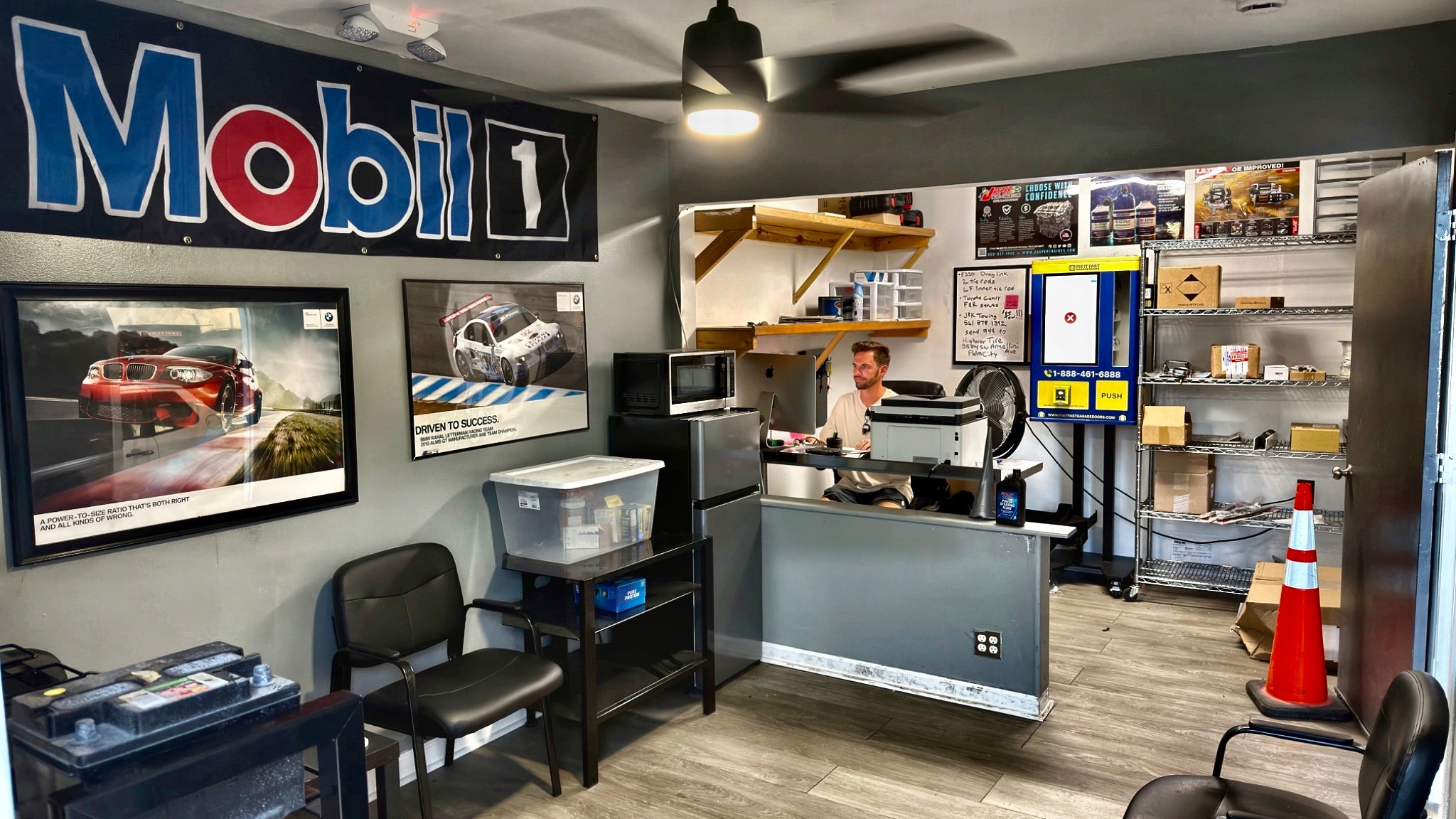 Collin at the reception desk in his actual Blue Water Motorsports office