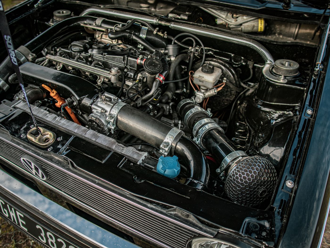 Close-up of engine-bay components; illustrative service photography